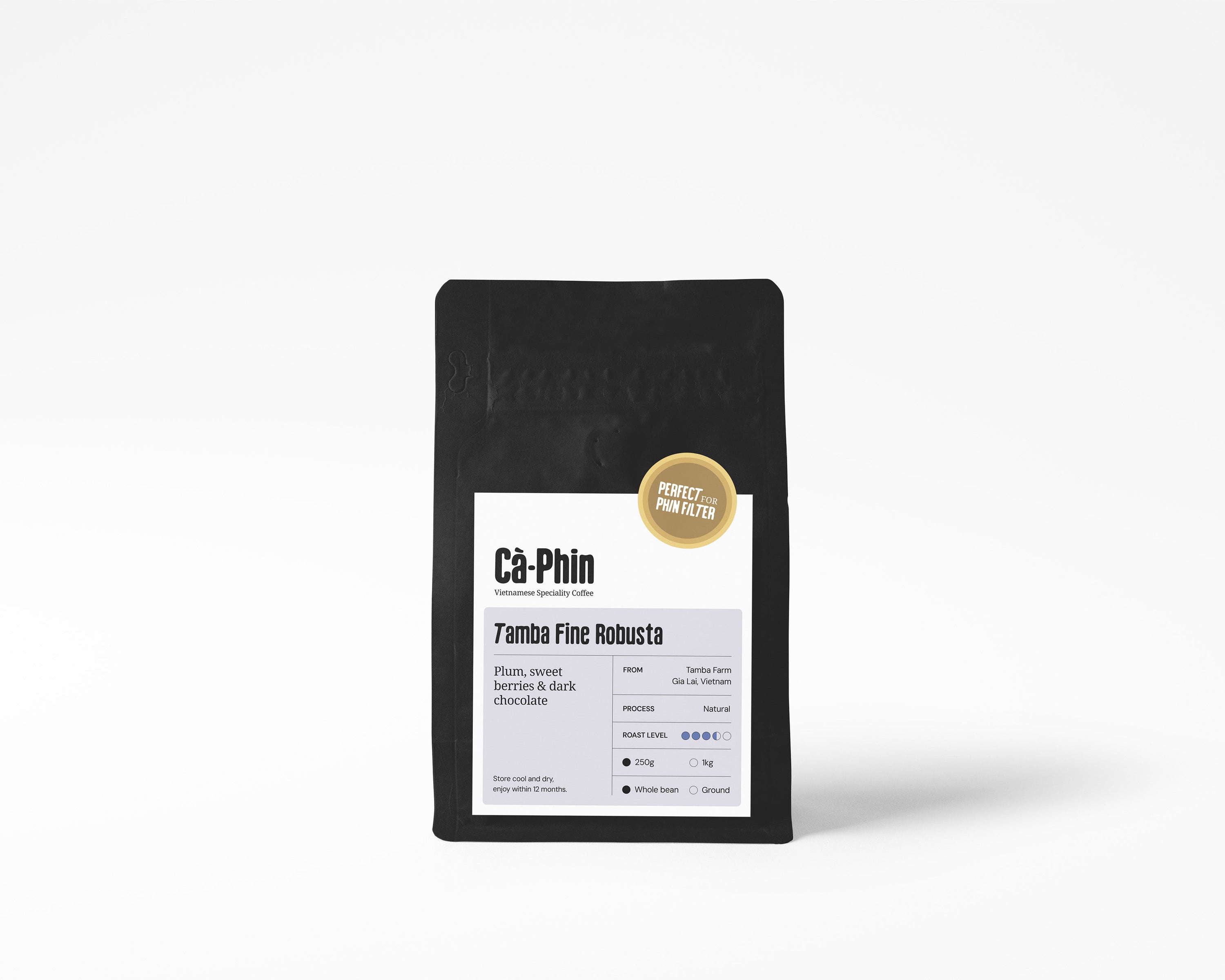 A matte black stand-up pouch of coffee centered on a light gray gradient background. The front label reads 'Ca Phin Vietnamese Speciality Coffee' and 'Tamba Fine Robusta,' with a small gold circular badge that says 'Perfect for Phin Filter
